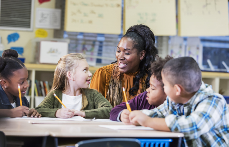 Teacher with students in classroom