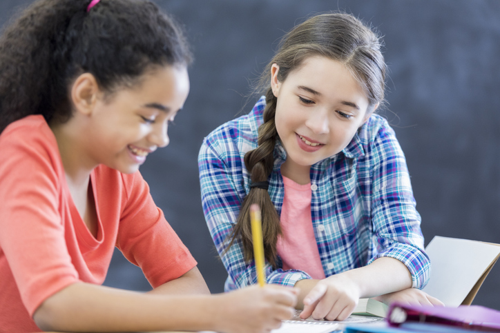 Students Writing in Notebooks